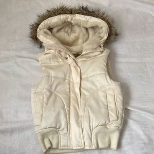 Puffer vest with faux fur hood
